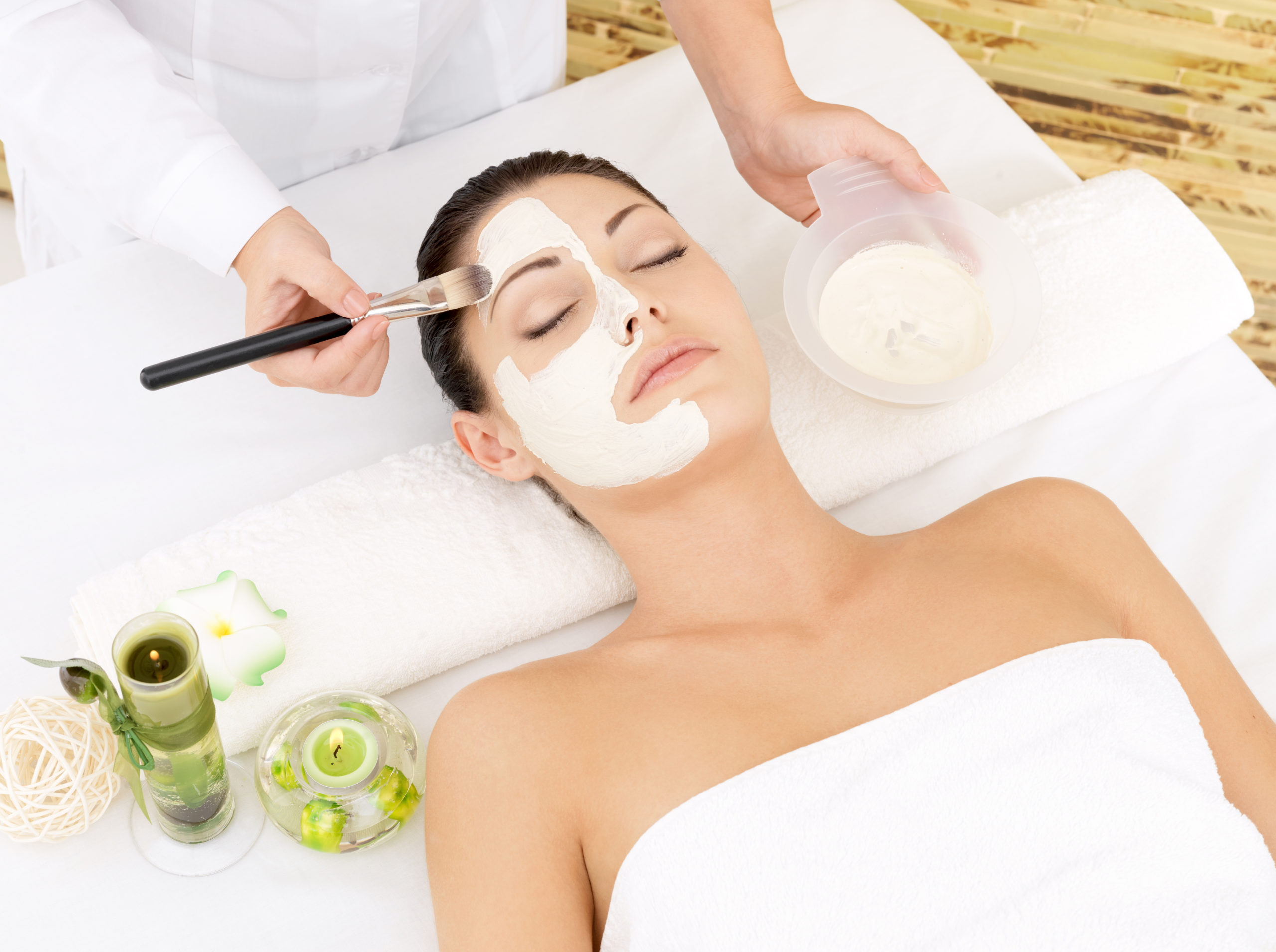 young woman spa salon with cosmetic mask face high angle photo scaled