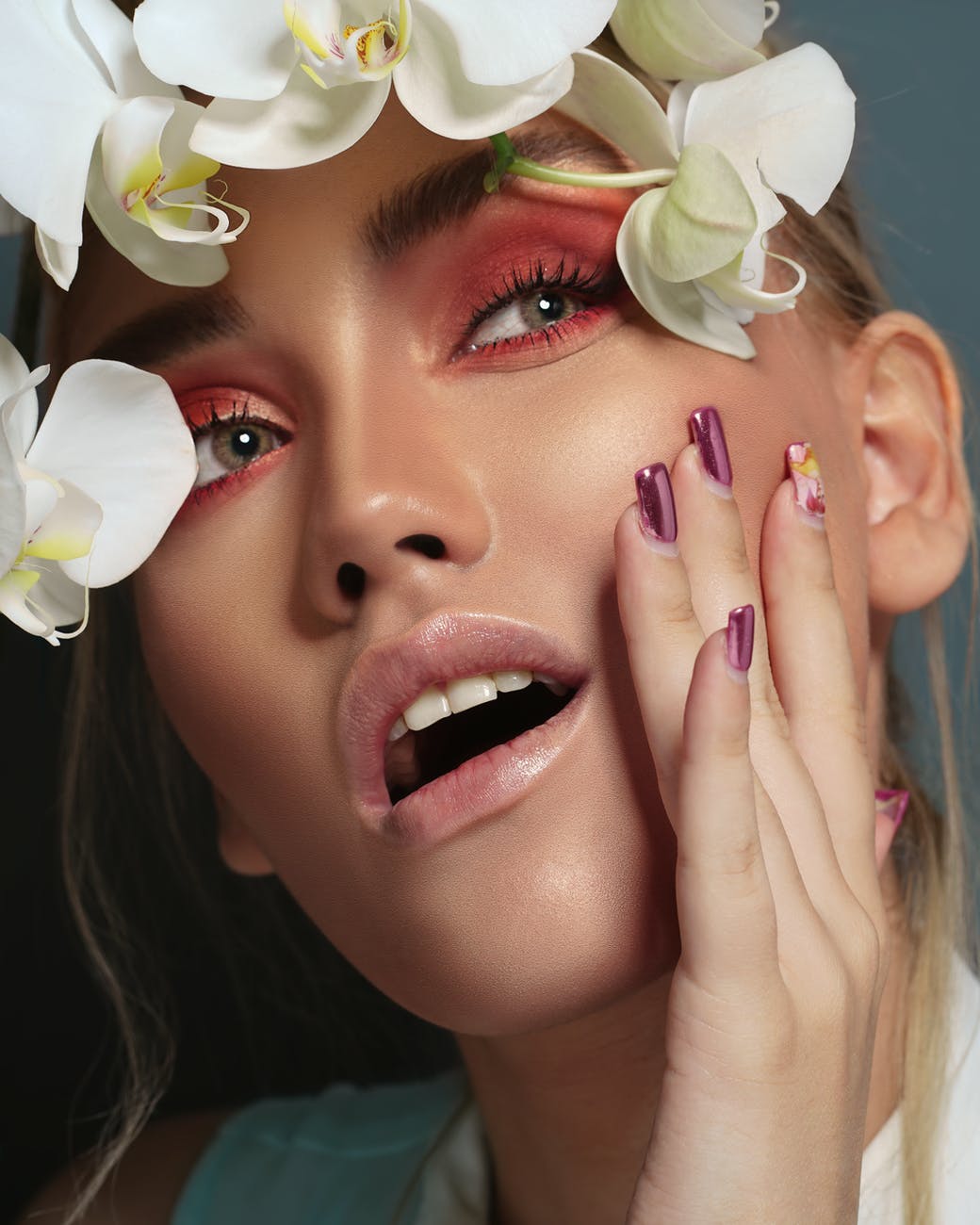 woman with white flower on her face
